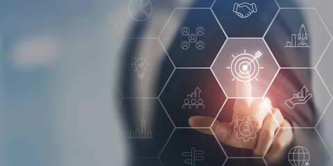 Business strategy concept. Touching screen on the icon representing business strategy elements;...