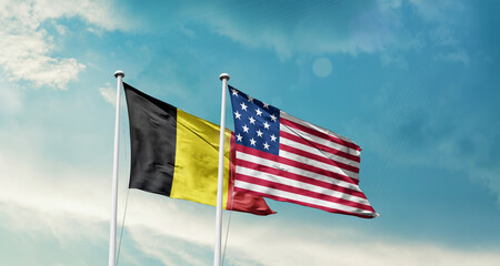 Belgium and America friendship flags are waving in the sky.Two country flag for agreement or deal. Belgium USA national flag for comittment.
