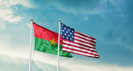 Burkina Faso and America friendship flags are waving in the sky.Two country flag for agreement or deal. Burkina Faso USA national flag for comittment.