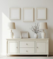 Simple, elegant, white living room.  Three framed prints, two lamps, and a console table create a serene atmosphere