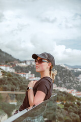 Travel,Young female traveler walking alone alongscenic mountain road solo travel, digital nomad...