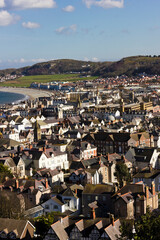 Bird's eye view overlooking the rooftops of the seaside town of Llandudno including the Parade in the distance, Creuddyn Peninsula, Conwy, North Wales
