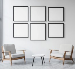 Six blank frames on white wall above armchairs and coffee table.