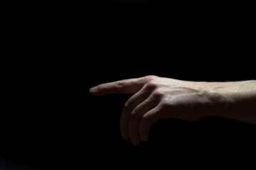 Fototapeta premium Male hand on black background