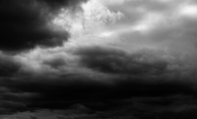 dark dramatic sky with black stormy clouds before rain as abstract background, extreme weather