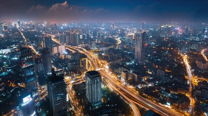 Obraz premium Aerial view of city highway intersection at night