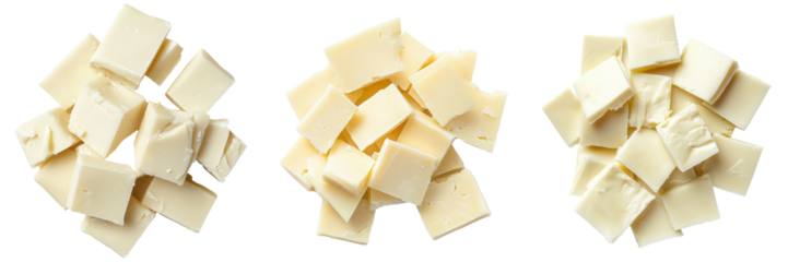 Three piles of broken white chocolate squares.