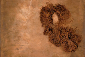 Copper wire on the copper background. Old copper wire for the scrap.
