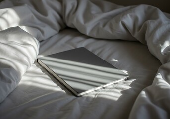Laptop on bed white sheets morning light study relaxation work from home