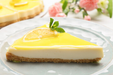 Piece of delicious cheesecake with lemon curd served on table, closeup