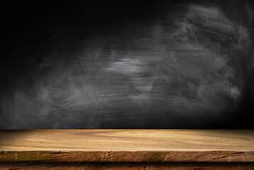 Wooden table in dark room background concept for advertising.