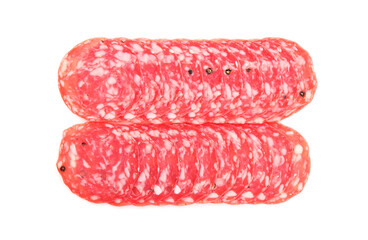 Slices of tasty smoked sausage with spices on white background, top view