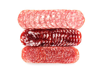 Slices of different tasty smoked sausages on white background, top view