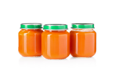 Baby food. Tasty puree in glass jars isolated on white