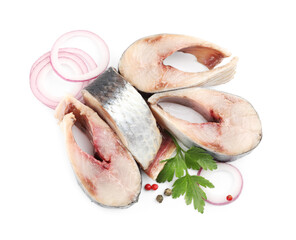 Pieces of delicious herring with spices isolated on white, top view