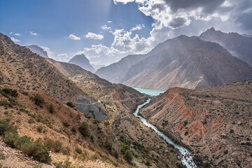Colorful landscape view of lake Iskanderkul in Fann mountains with turquoise Iskander darya river, Sughd, Tajikistan