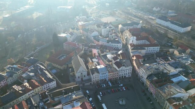 Olomouc, Czech Republic: Aerial drone footage of the Marian Plague Column in baroque style in the upper square in Olomouc medieval old town with cinematic morning light