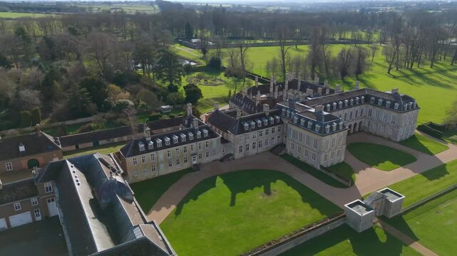 Aerial video of a mansion in Northampton surrounded by manicured gardens. Britain