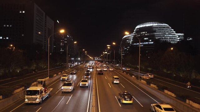 The night when vehicles shuttle at Galaxy SOHO in Beijing, China