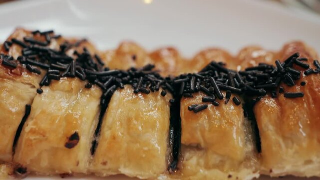 Traditional Catalan dessert made from puff pastry with chocolate filling Canya de xocolata. High quality 4k footage