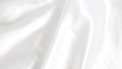 Obraz premium Smooth white silk fabric with soft folds and gentle light reflections