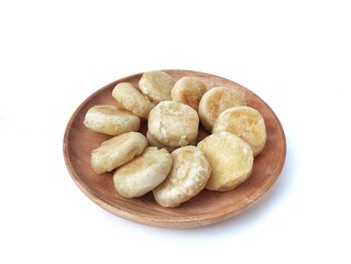 Bakpia cake or Indonesian typical traditional food on wooden plate isolated on white background, high angle view 