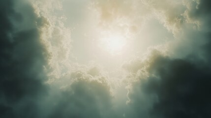 Sun shining through dark clouds.