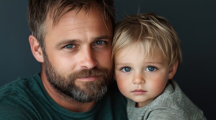A touching portrait depicting a father lovingly holding his child, showcasing warmth, connection, and the beauty of their bond against a dark backdrop.