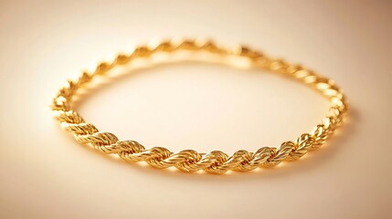A twisted gold chain necklace positioned on a cream-colored background with soft light