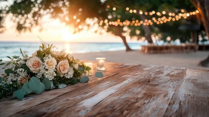 A beautifully arranged bouquet rests on a rustic table, with a sunset and soft string lights creating a romantic beach wedding atmosphere that invites love and celebration.