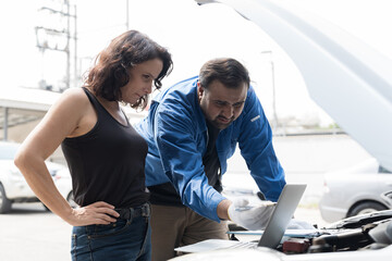 Customer, employee, car mechanic working on engines as mechanic in garage for repair, maintenance and vehicle service. Small business, startup and garage concept