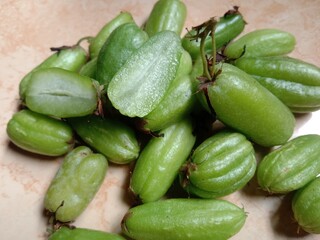 close-up of starfruit or belimbing wuluh. starfruit vegetables. averrhoa bilimbi. starfruit is widely used as a cooking spice that has a sour taste and has many benefits.