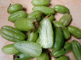 close-up of starfruit or belimbing wuluh. starfruit vegetables. averrhoa bilimbi. starfruit is widely used as a cooking spice that has a sour taste and has many benefits.