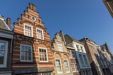 Fototapeta premium Historic buildings with a blue sky background in Dordrecht