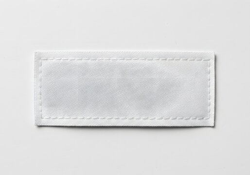 Blank White Rectangular Label with Stitched Border on White Background Text Space.