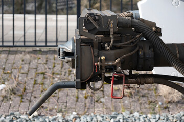Close-up of a modern locomotive coupler of a regional train in the Netherlands. Railway coupler. Side view