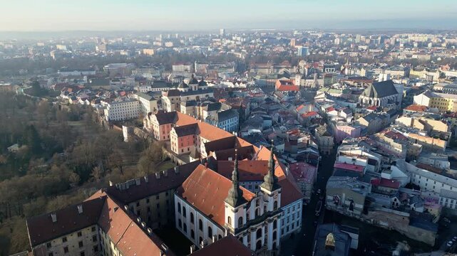 Olomouc, Czech Republic: Aerial forward drone footage of the Church of Our Lady of the Snows and medieval old town in Czech Republic in early morning