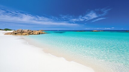 A sun-drenched beach on the Isles of Scilly, with turquoise water and white sands resembling the Caribbean
