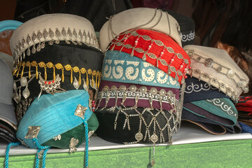 Traditional women's Asian headdresses are skullcaps made of thin velveteen with metal decorations....