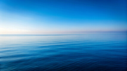 Obraz premium Endless Blue Water and Misty Sky and Soft Gradient Coastal Scene with Calm Waves