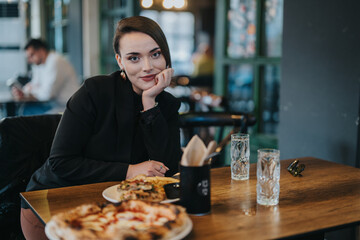 A professional woman sitting in a restaurant, smiling at the camera, with food and drinks on the table, representing leisure during a formal business meeting or casual dining experience.