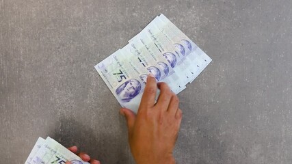 Counting and Saving money concept. Savings at home. Budgeting and keeping cash for unexpected expense.