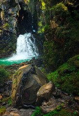 waterfall long exposure river flow good light in the alps