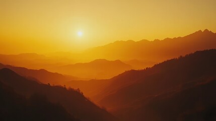 Fototapeta premium Sunrise over misty mountain range, tranquil view