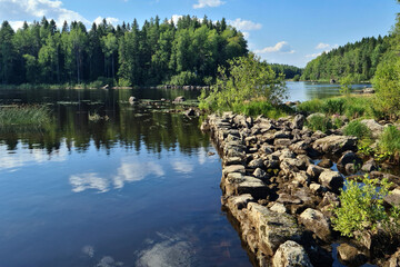 Stones and water. View in Konnuskoski, Leppavirta, Finland.