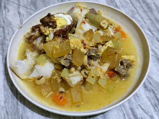 Ketupat Lebaran. Chicken vegetable ketupat is a typical Indonesian dish that is famous for its deliciousness and has a special place in Indonesian culinary culture