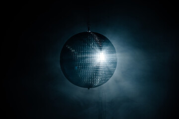 Disco ball reflection of light at night. Party, birthday and holiday concept.