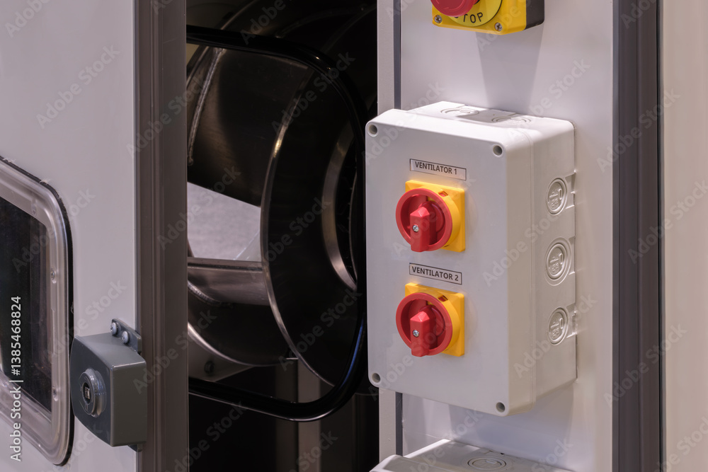 Poster A white box with red and yellow buttons on it. The box is open and the fan is visible