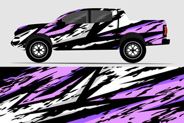 Stylishly designed pickup truck with a vibrant purple and black graphic wrap, showcased on a neutral background © Cargovista