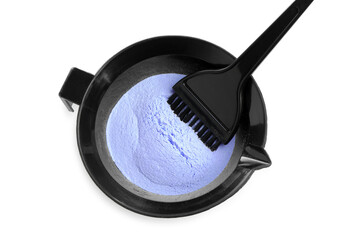Bowl with hair bleaching powder and brush isolated on white, top view